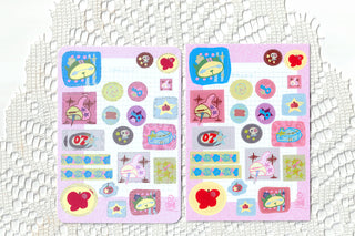 Two sheets of Spring has Sprung stickers on a white lace background