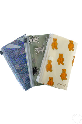 Three small TIDY 5 pocket pouches on a white background. 