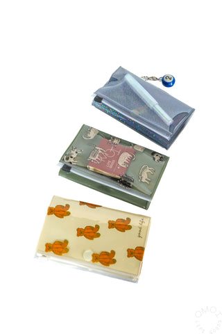 Three 5 pocket pouches laid out on a white background