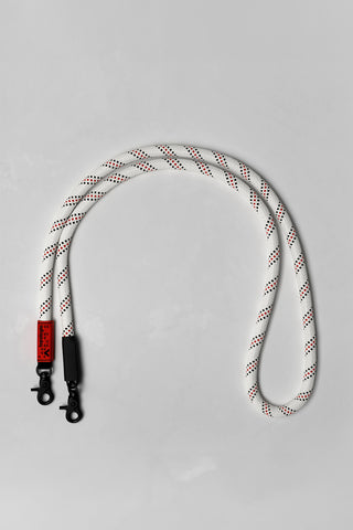 White rope with red accents on a gray background