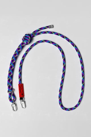 Colorful braided strap with a red tag on a light gray background