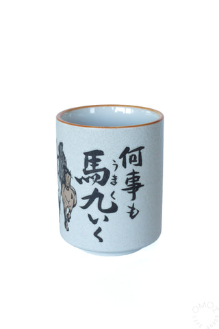 Horse teacup with black horse graphic and Japanese characters on light blue body