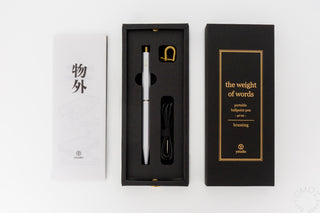 ystudio white pen in black box on a white background