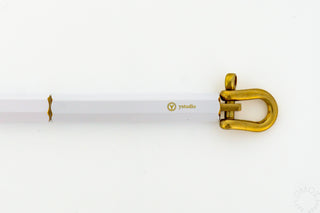 Close up of the top of ystudio white pen on a white background